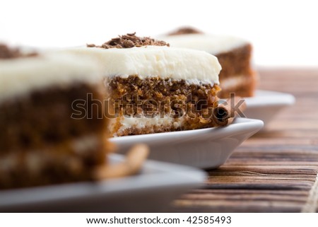 Delicious pieces of carrot cake with cinnamon stick