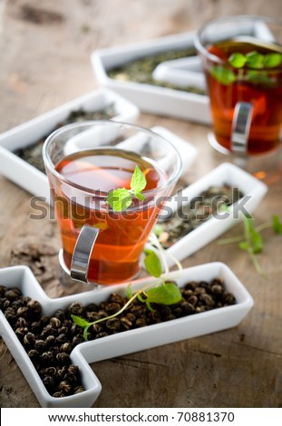 Tea leaves in letters and two cups of tea