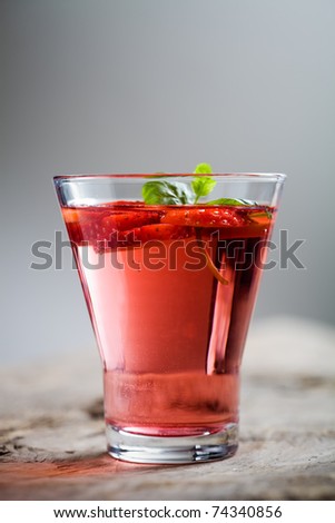 Cold strawberry drink with strawberry slices and mint