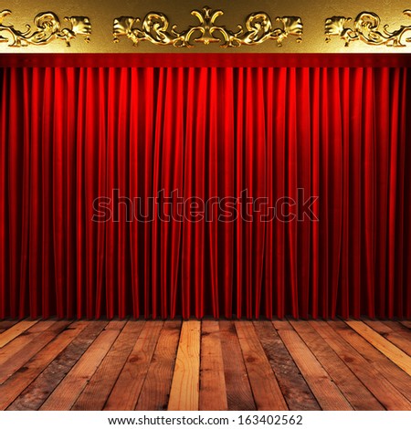 red fabric curtain with gold on stage