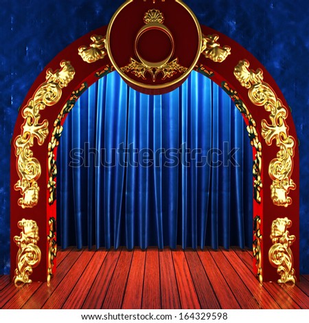 blue fabric curtain with gold on stage