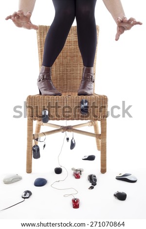 rise to a chair woman being attacked by computer mice, metaphor of phobia