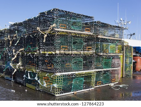 Lobster traps also know as pots,  on a pier ready to go out to sea.