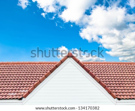 red rooftop against blue sky