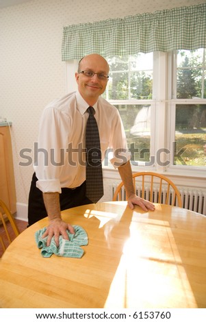 Man Cleaning Kitchen