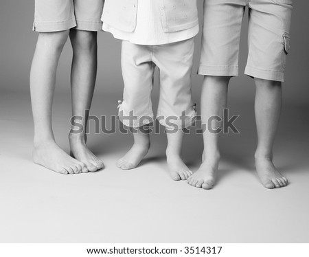 three siblings bare feet