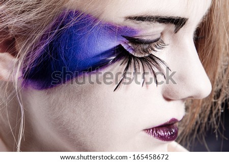 close-up of an eye with fake eyelashes and original make-up