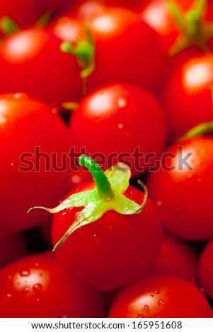 plenty of little red cherry tomatoes - food background