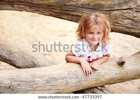 little blond girl with blue eyes smiling