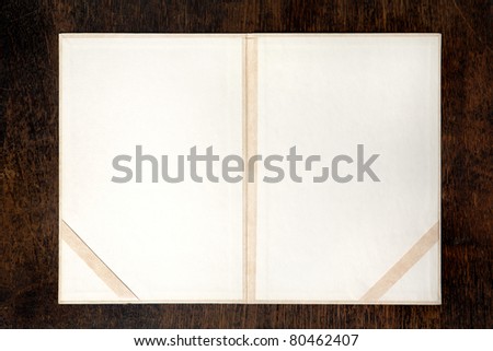 old, empty folder for diploma, on wooden background