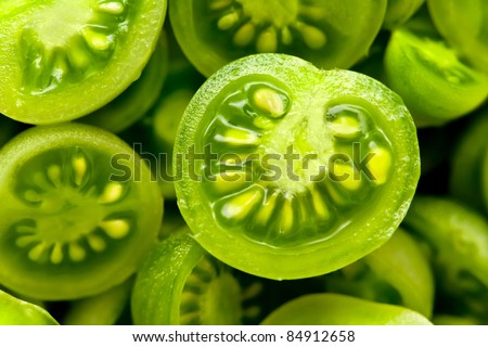 many little green coctail tomatos cut in half