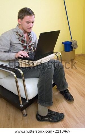 young man at computer thinking about his problem