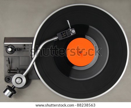 Vintage record player with vinyl phonorecord