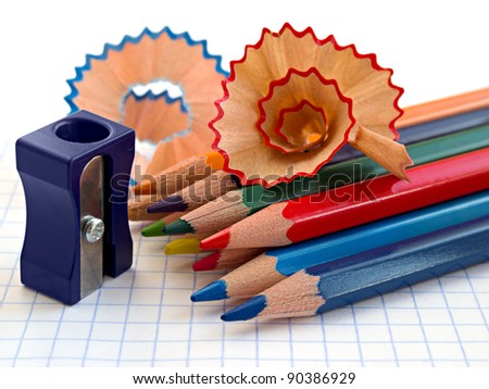 Writing tools - pencil sharpener, colored pencils, spiral wooden shavings