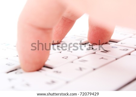 Human finger on a laptop keyboard. Typing