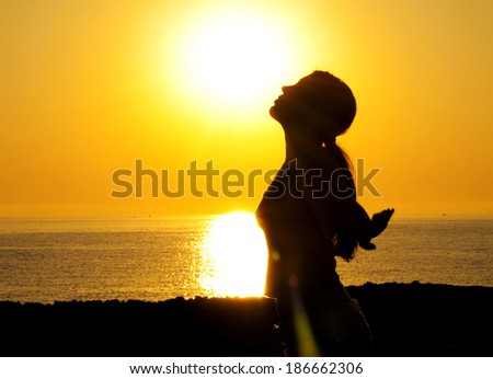 A beautiful girl silhouette free in the sun A beautiful girl silhouette free in the sun