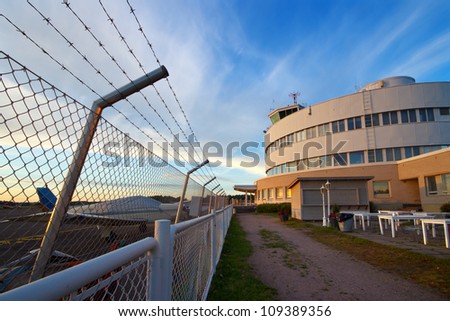 Small plane airport security fence and traffic control building in Helsinki, Finland