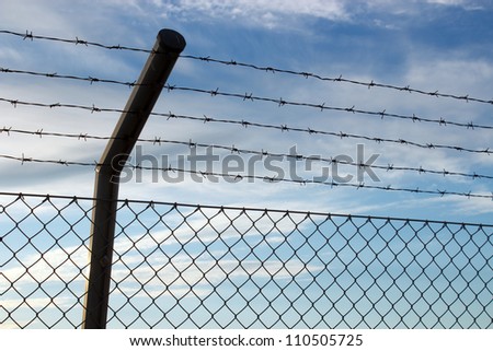 Private area fence with barbed wires