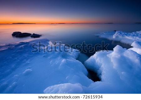 stock photo Before sunrise in icy beach