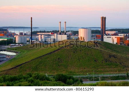 Vuosaari power plants behind the green hill.  The source of energy used at Vuosaari is natural gas.