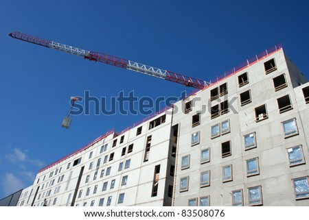 Apartment construction site with crane