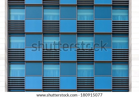 blue color windows of modern office building horizontal background