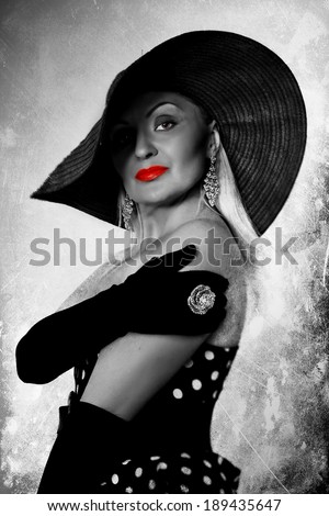 Black, white and red closeup fashion portrait of glamour woman\'s face with red lips and creative  hairstyle.
