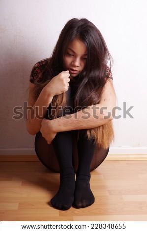 young asian woman with scars from deliberate self-harm