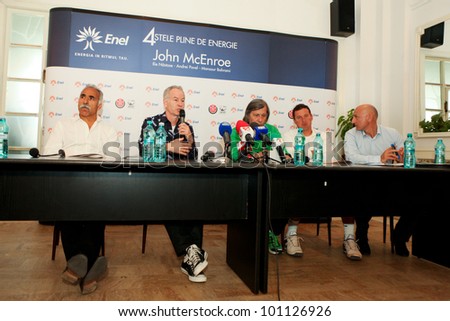 BUCHAREST, ROMANIA- APRIL 24: Mansour Bahrami, John McEnroe, Ilie Nastase, Andrei Pavel speak to the media during BRD Nastase Tiriac Trophy press conference, on April 24, 2012 in Bucharest, Romania