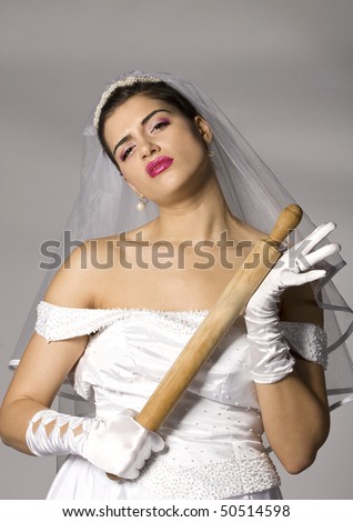 Killer bride photo series. Bridezilla with wooden rolling pin. Studio shot