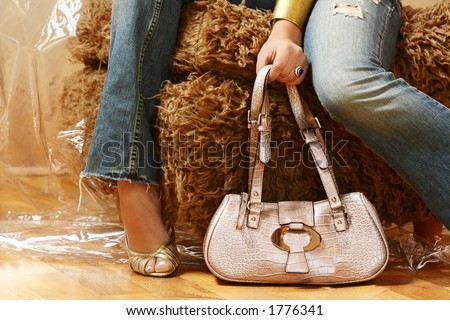 stock photo A fashion shoot of the legs of a female model in jeans