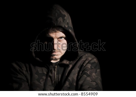 dark and moody portrait of a menacing male