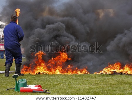 man putting a fire out