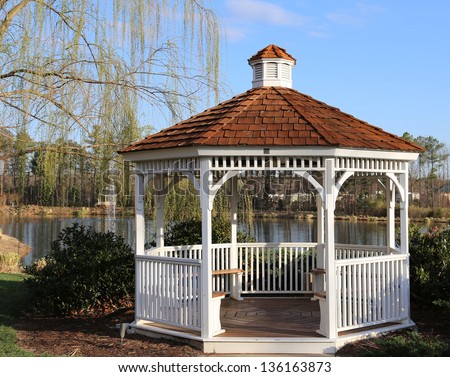 Open air wooden gazebo overlooking a pond an ideal place for picnics, photo shoots and engagement pictures