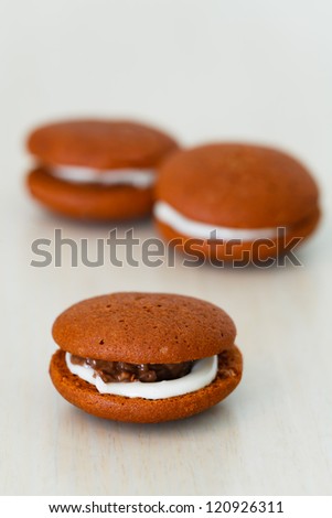 Chocolate marron cookies with nuts and white chocolate cream
