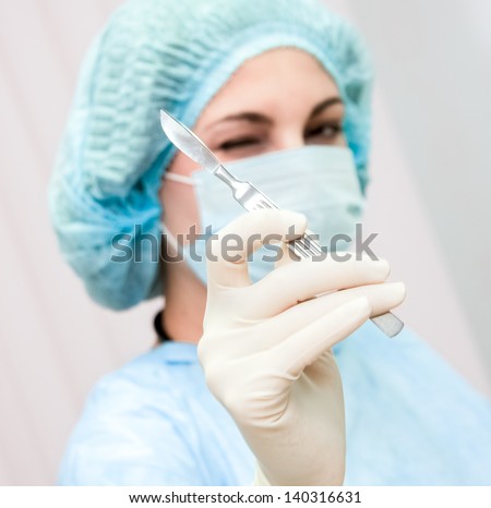 Young female surgeon in surgical clothes