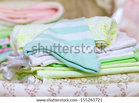 stack of clean baby clothes