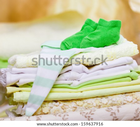 stack of clean baby clothes