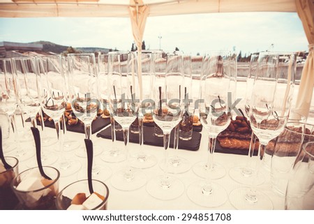 Buffet table close-up. Champagne glasses.