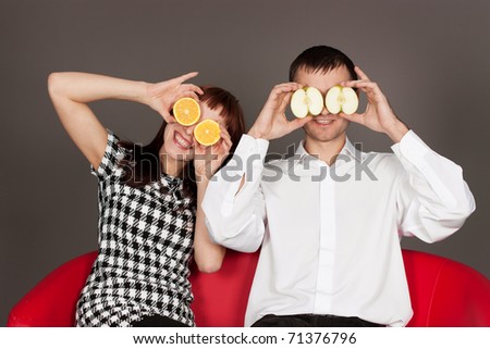 Morimos??? XD ¿y... por que no? - Página 18 Stock-photo--funny-couple-shutting-eyes-with-apple-and-orange-in-studio-against-gray-71376796