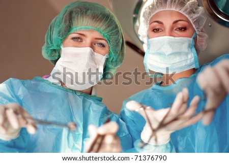 Two female surgeons operate in the hospital