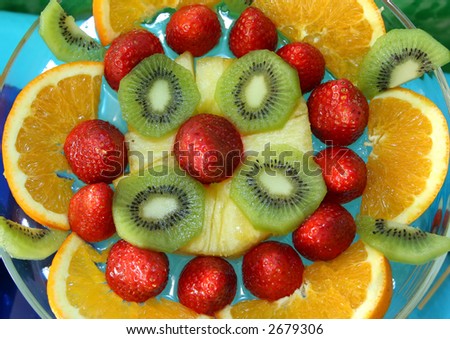 orange, strawberries, kiwi and other fruits in a salad