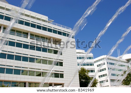 office building with blurred water spring