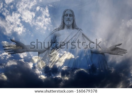 Jesus standing in white and gray storm clouds in blue sky with rays of light