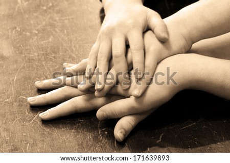 Several children hands on top of each other
