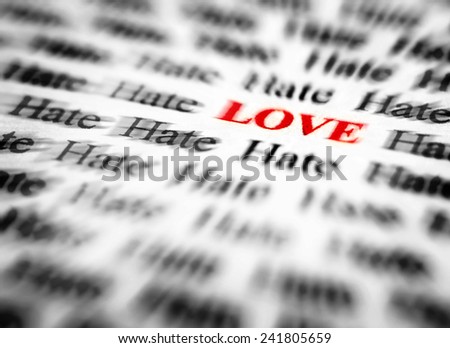 Closeup detail of black and white words with red word love