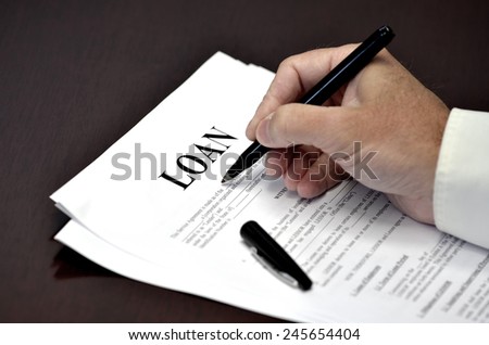 Loan document and agreement with pen for signing