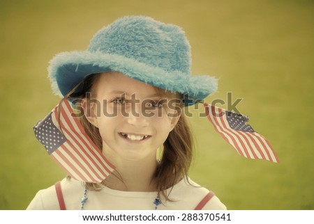 Detail portrait of girl with patriotic flags instagram style