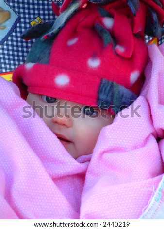 Portrait of baby bundled up in winter clothing to stay warm