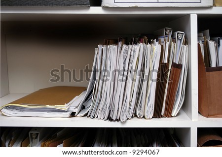 Office shelves full of files and boxes